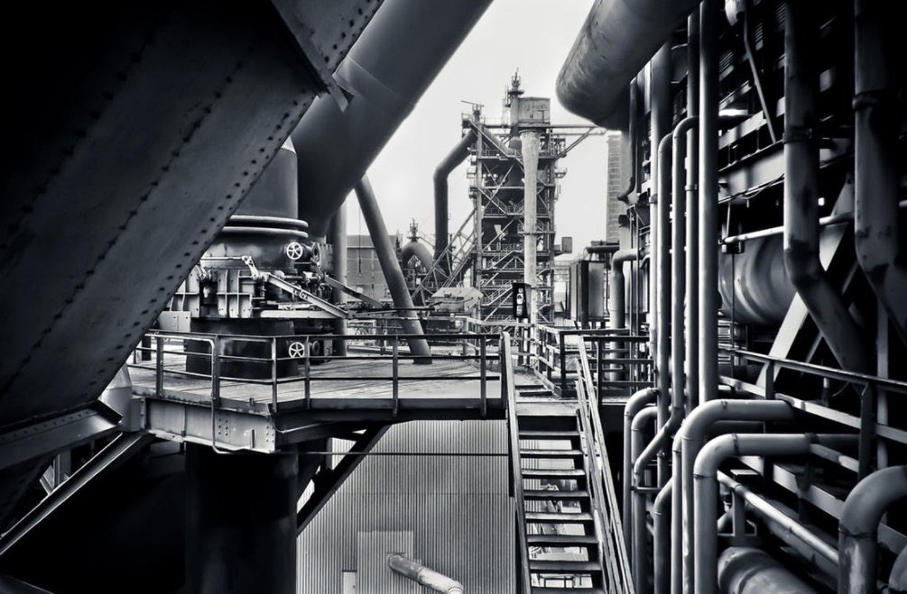 Oil refinery interior with industrial piping and equipment